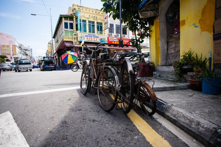 Penang, Malaysia architecture narrow streets. Dirty moldy humidity cityscape