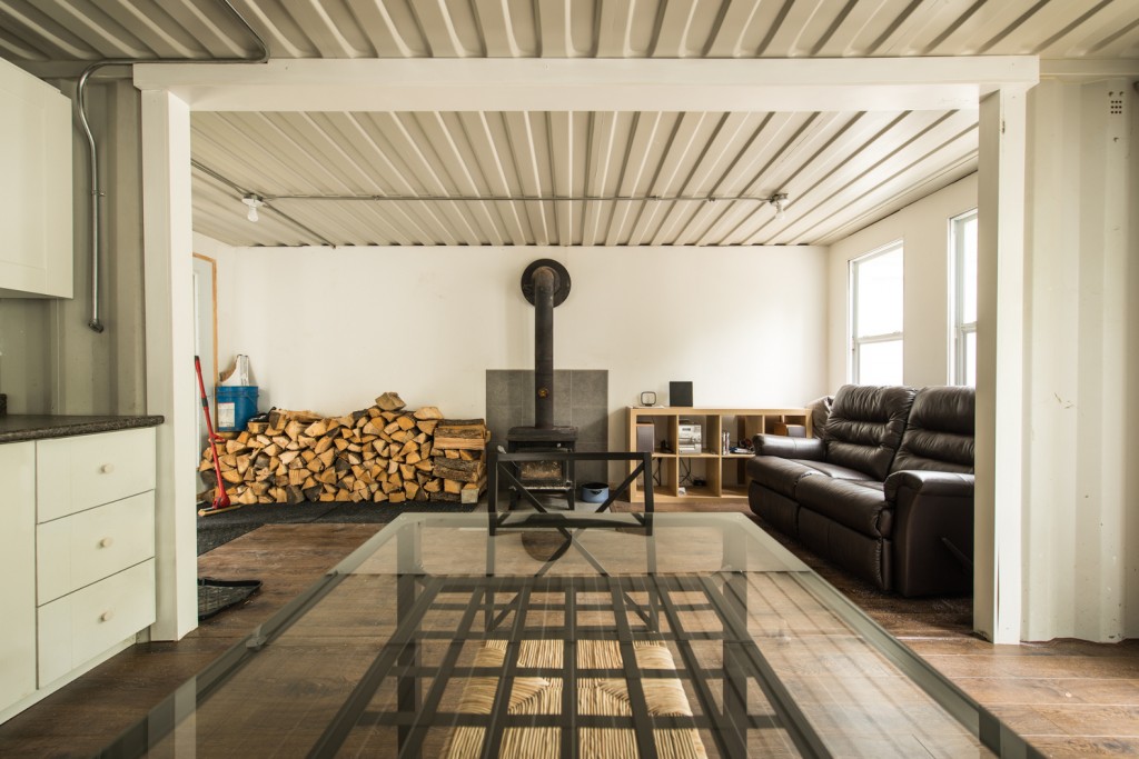 Joseph-Dupuis-shipping-container-home-wood-burning-stove