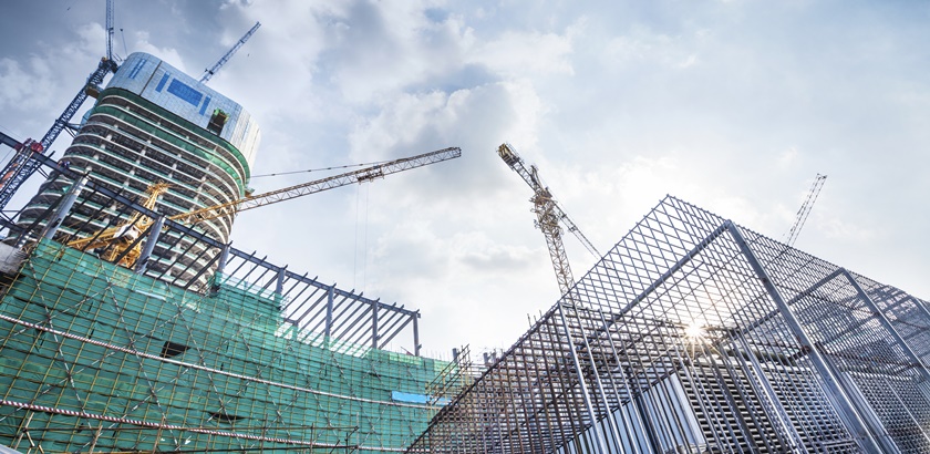 Construction site with crane and building in city