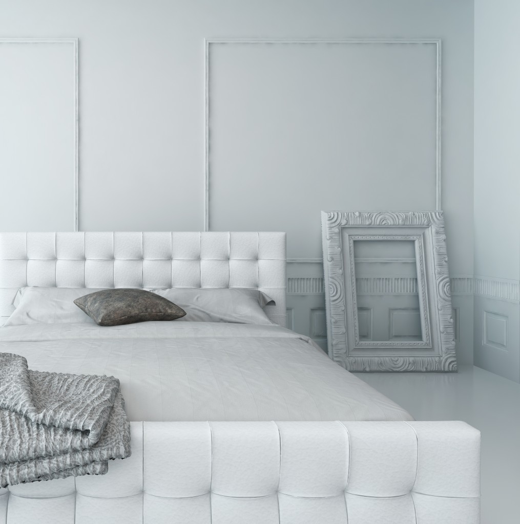 White leather bed in a white luxury paneled bedroom interior