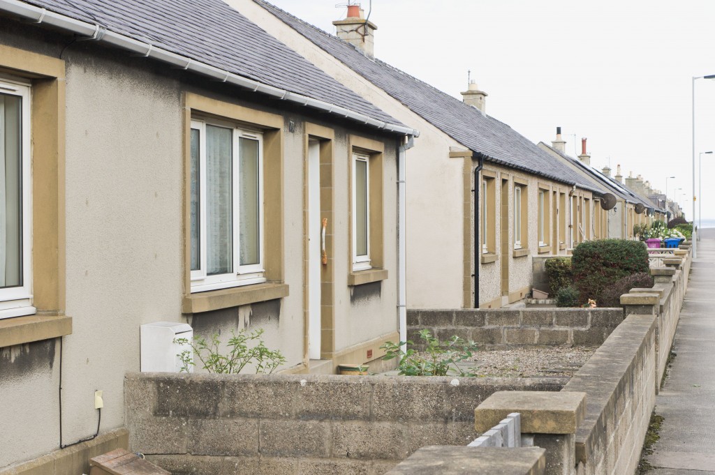 55325984 - a row of bungalows on a street in lossiemouth, scotland