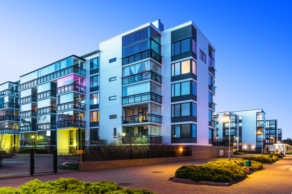 House building and city construction concept: evening outdoor urban view of modern real estate homes