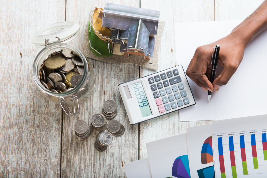 hands calculating home mortgage