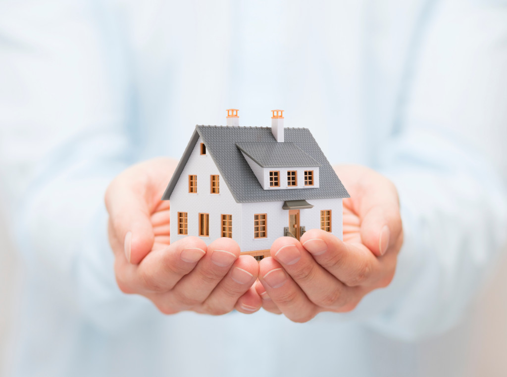 Small,Toy,House,In,Hands