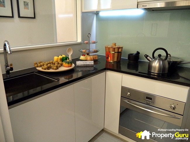 In a ready-made unit there will a full wall instead of this see-through glass window in this show kitchen