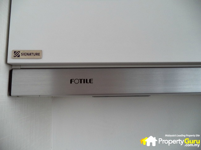 Kitchen cabinet by Signature and exhaust fan by Fotile