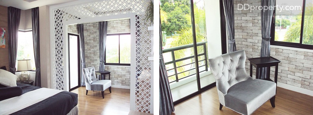 ภายในห้องนอนใหญ่ กั้นแบ่งพื้นที่เตียงนอนกับมุมนั่งเล่นด้วยพาทิชั่นไม้ลายฉลุทาสีขาวให้ดูเป็นไอเดียซึ่งอยู่ใกล้กับระเบียงด้านนอก 