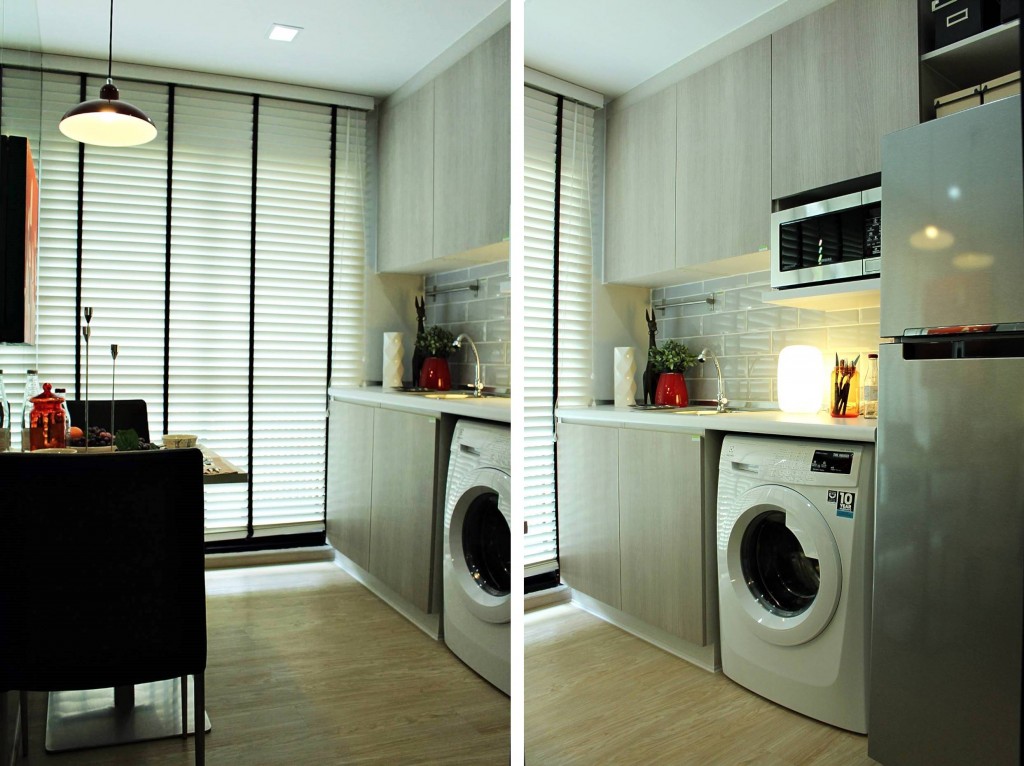 พื้นห้องครัวเป็นไวนิลลายไม้ ด้านซ้ายมือเป็นโต๊ะรับประทานอาหาร ส่วนขวามือเป็นครัวบิลท์อินเต็มพื้นที่ผนัง พร้อมเครื่องใช้ไฟฟ้าบางส่วนซึ่งเป็นไปตามโปรโมชั่นของโครงการ