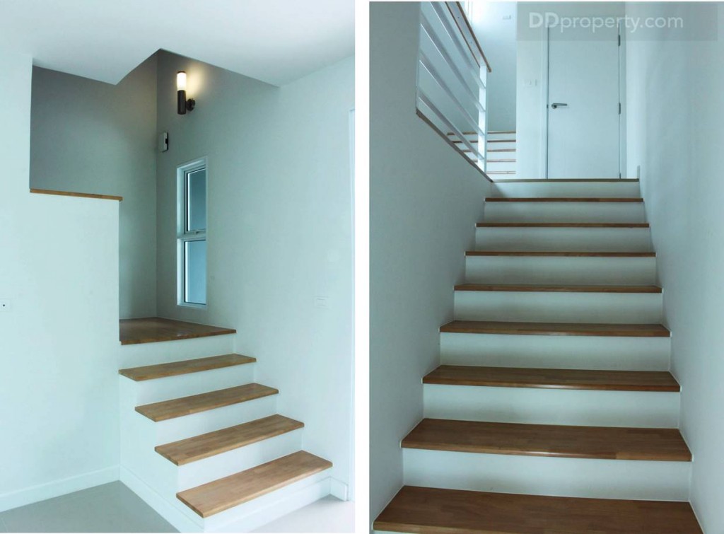 ส่วนบันไดเป็นคอนกรีตเสริมเหล็กเพื่อความแข็งแรงทนทาน ปูพื้นผิวด้วยไม้ให้ความรู้สึกที่อบอุ่นและมีเสน่ห์