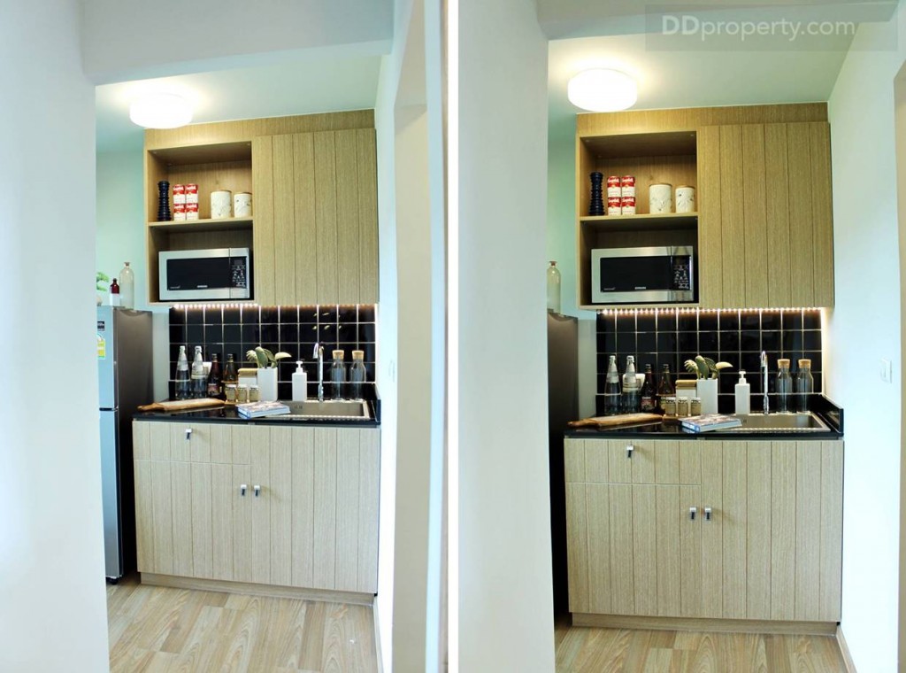 ชุดครัวบิลท์อินที่ทางโครงการทำมาให้ ซึ่งดูให้ดีจะเห็นว่าความสูงของห้องครัวจะลดลงเหลือ 2.4 เมตร เนื่องจากมีการเดินระบบต่างๆ ไว้บนเพดานห้องครัว