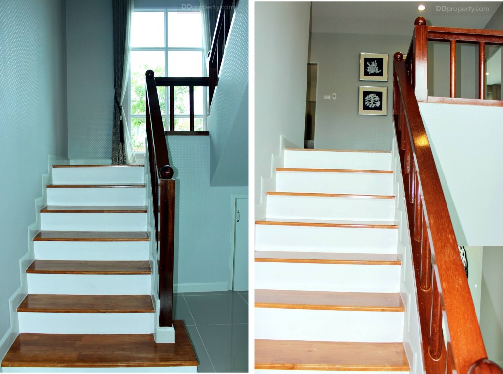 บันไดเป็นคอนกรีตเสริมเหล็กกว้าง 1 เมตร ท็อปด้วยไม้สำเร็จรูป ราวบันไดเป็น ไม้มะค่า  