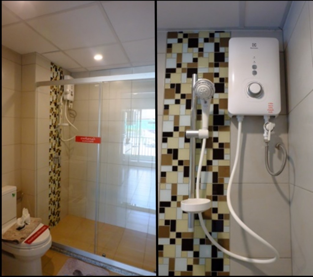 ฉากกั้นอาบน้ำเป็นประตูกระจก safety บานเลื่อน เครื่องทำน้ำอุ่นแถมเป็นแบรนด์ Electrolux ตำแหน่งแขวนสายฝักบัวบนผนังให้ตามสเปคในรูป