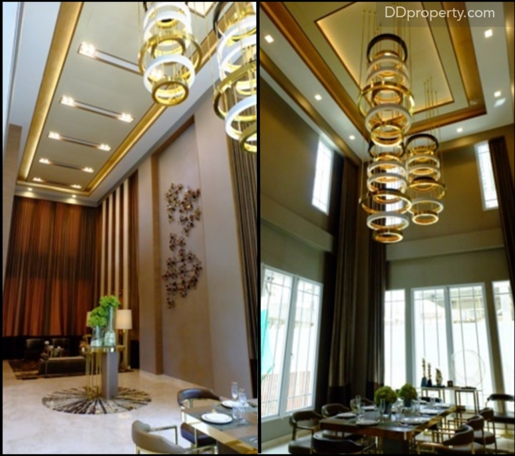 ถัดมาทางฝั่งซ้ายมือเป็นส่วนของห้องนั่งเล่นและโซนรับประทานอาหาร ขนาดใหญ่ที่มาพร้อมกับความสูงเพดานอลังการที่ 12 เมตร, ตัวฝ้า (เฉพาะบ้านตัวอย่าง) จะมีลูกเล่นไล่เป็นระดับ แซมด้วยเส้นขอบทองเหลืองซึ่งเมื่อกระทบกับแสงไฟจะทำความรู้สึกหรูหราขึ้นมาทันที บ้านตัวอย่างมีการติดตั้ง chandelier มาด้วย