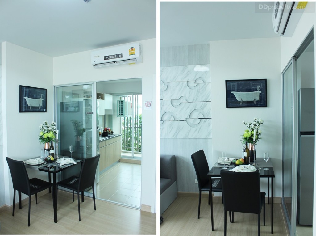 ถัดมาจะเป็นพื้นที่โต๊ะทานอาหารอยู่บริเวณด้านหน้าทางเข้าห้องครัว เหนือประตูติดเครื่องปรับอากาศขนาด 9,000 BTU