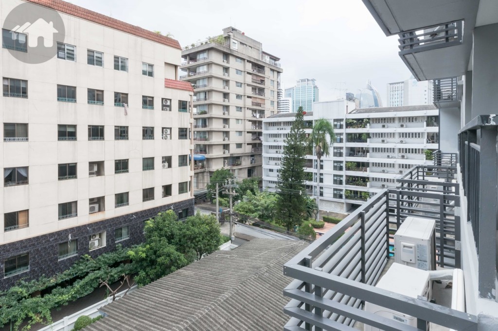 The air-conditioner compressors are located outside the balcony as shown in the picture