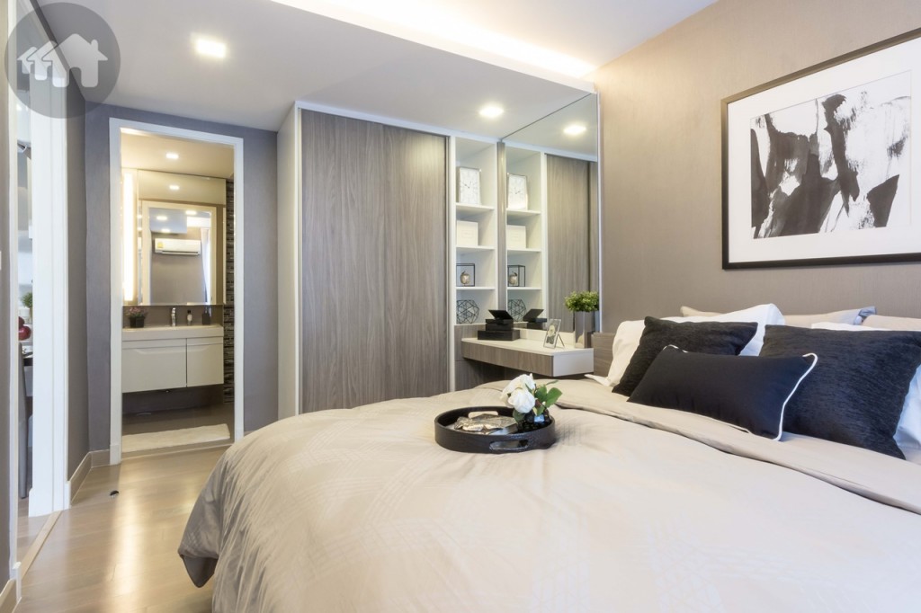 The en-suite bathroom’s entrance is right next to the built-in wardrobe