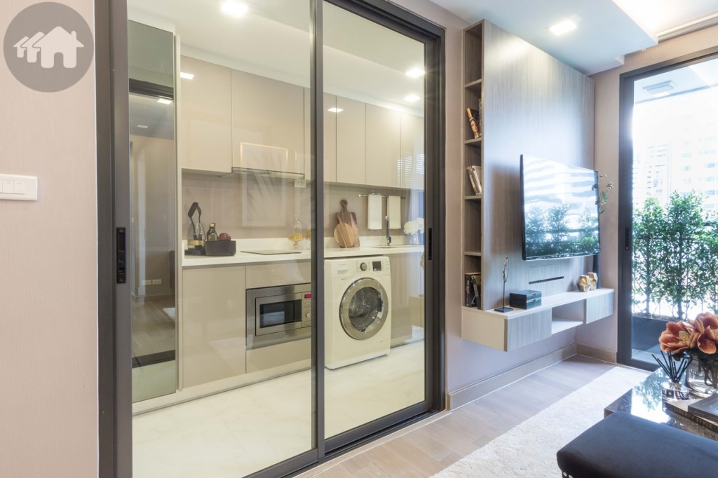 The kitchen is opposite the living room and enclosed behind the sliding doors (openable from both sides)
