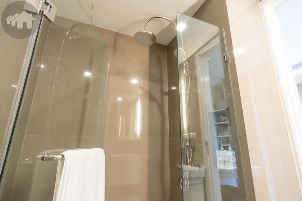 The shower room is enclosed with tempered glass, featuring both handheld and Rain showers (from Kohler), and a recessed shelf for placing toiletries. The shower area is 0.8x1.35 metre.