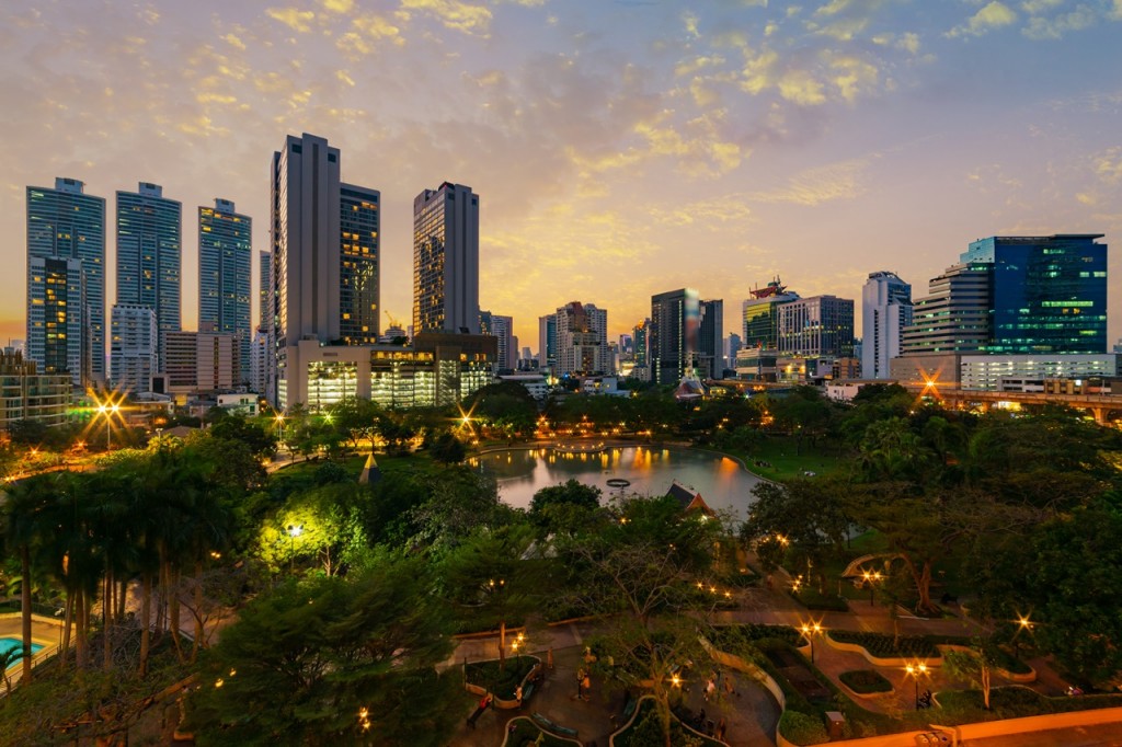 Sunset scence of Bangkok Panorama ,Aerial view of Bangkok modern office buildings and condominium in Bangkok city downtown with sunset sky and clouds at Bangkok , Thailand. Benjasiri Park