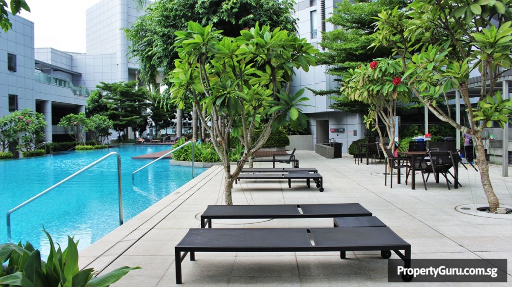 Photo of swimming pool and deck chairs