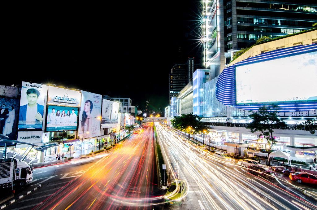Night light with long speed shutter of traffic at MBK, BTS Siam interchange in front of Siam Discovery and Art Museum junction.This place is very famous shopping mall at central of Bangkok