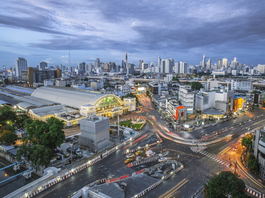 In front of "Hua Lamphong" The centre Bangkok Railway Station, Cityscape Bangkok downtown at twilight, from the top of tower skyscraper, Thailand. and technique long exposure and HDR filter.