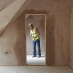 Building Inspector Looking At New Property
