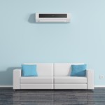 Air conditioning on the wall above the sofa cushions.