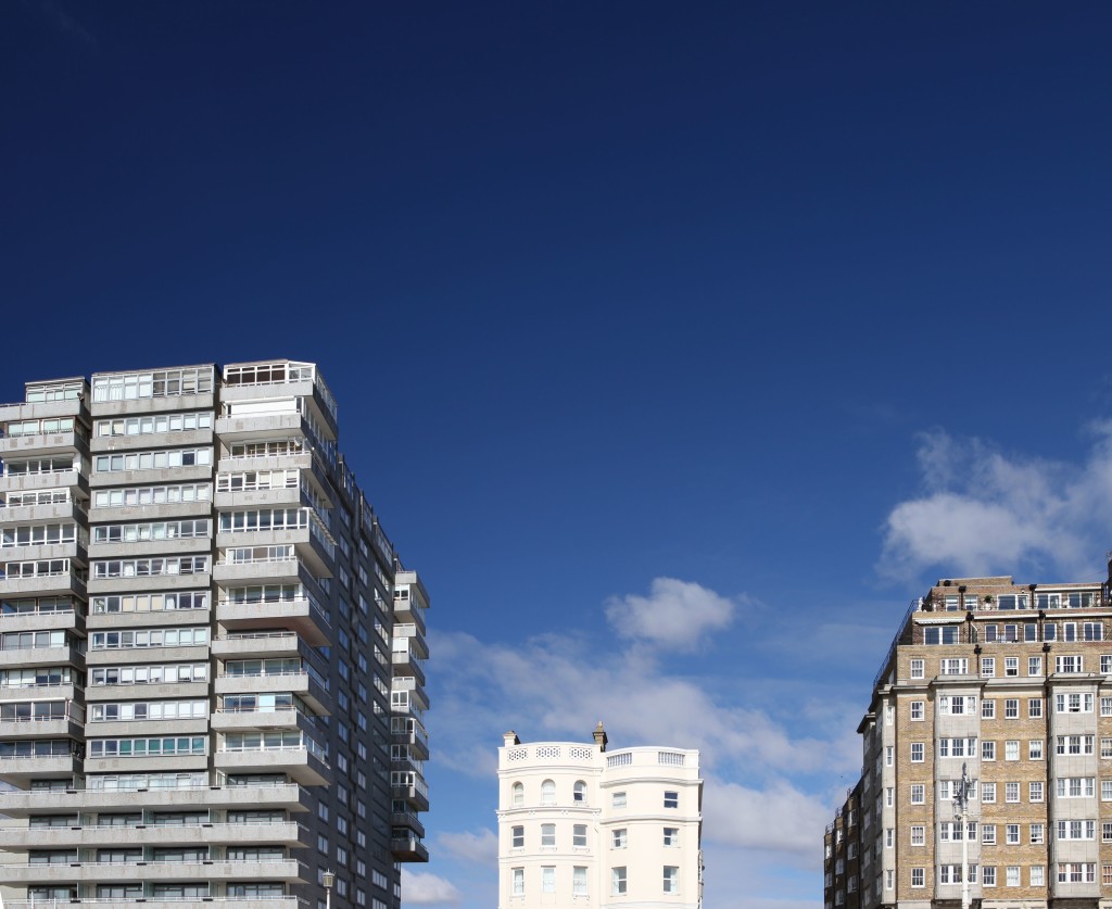 6845159 - tower block modern and classic against blue sky. offices, flats or apartments from three different time periods