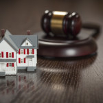 Gavel and Small Model House on Wooden Table home condo law
