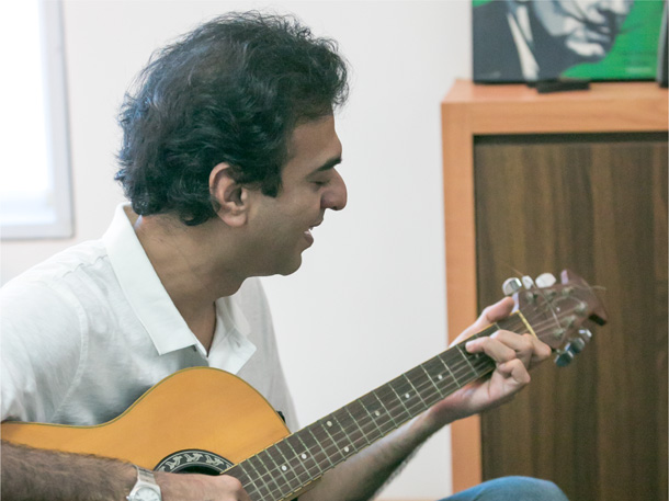 Sanjay playing the guitar