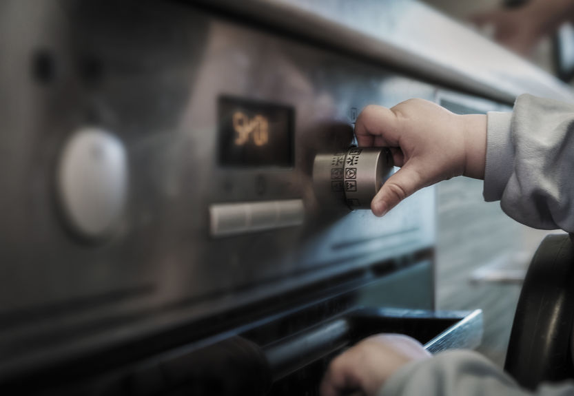 child playing with home oven