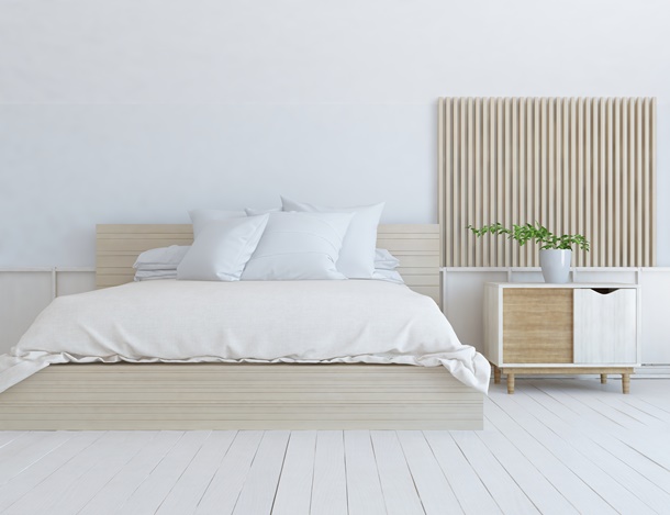 White,Minimalist,Bedroom,Interior,With,Double,Bed,On,A,Wooden